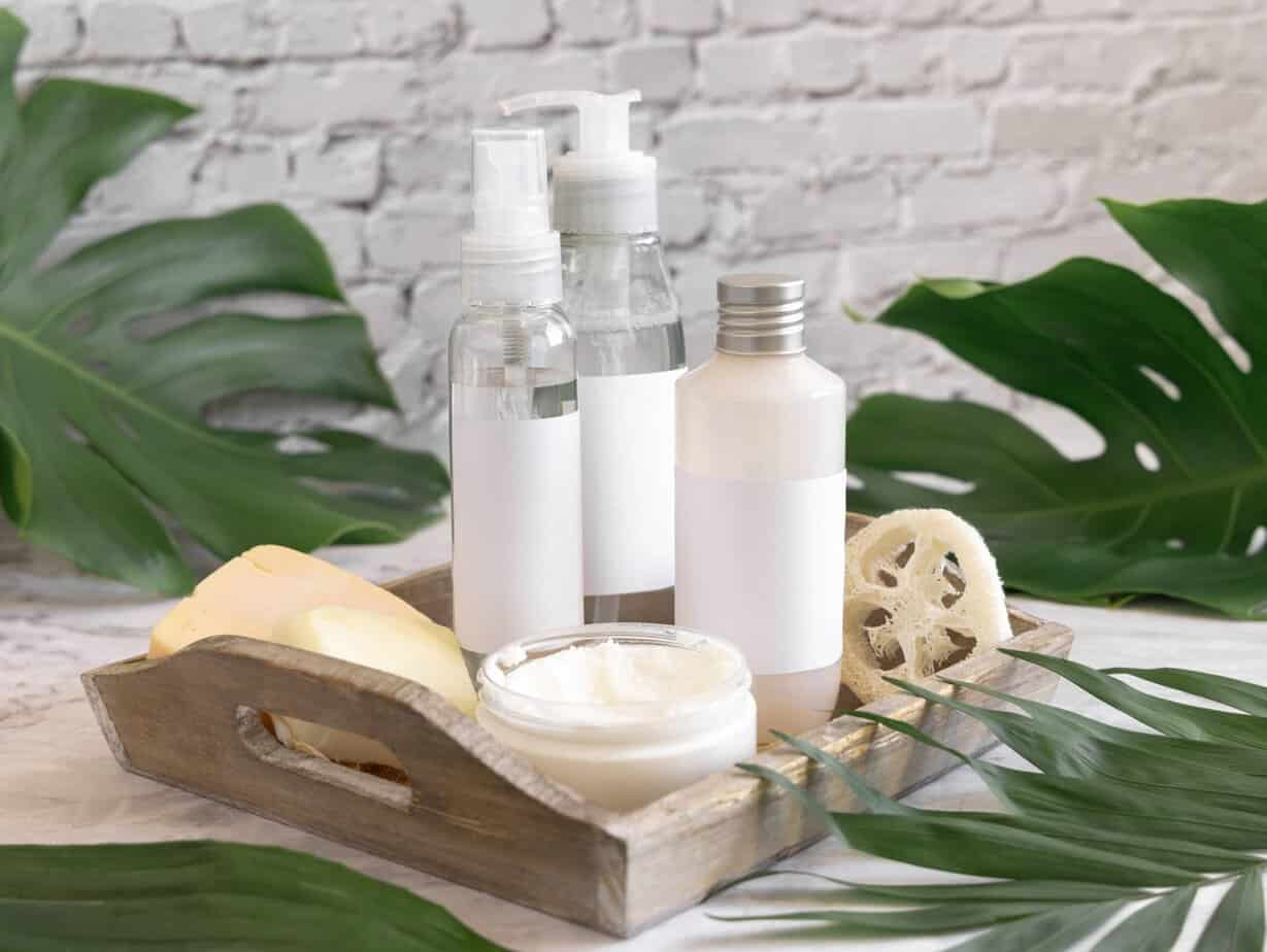 Facial serums, toners, moisturisers and masks arranged on a clean surface