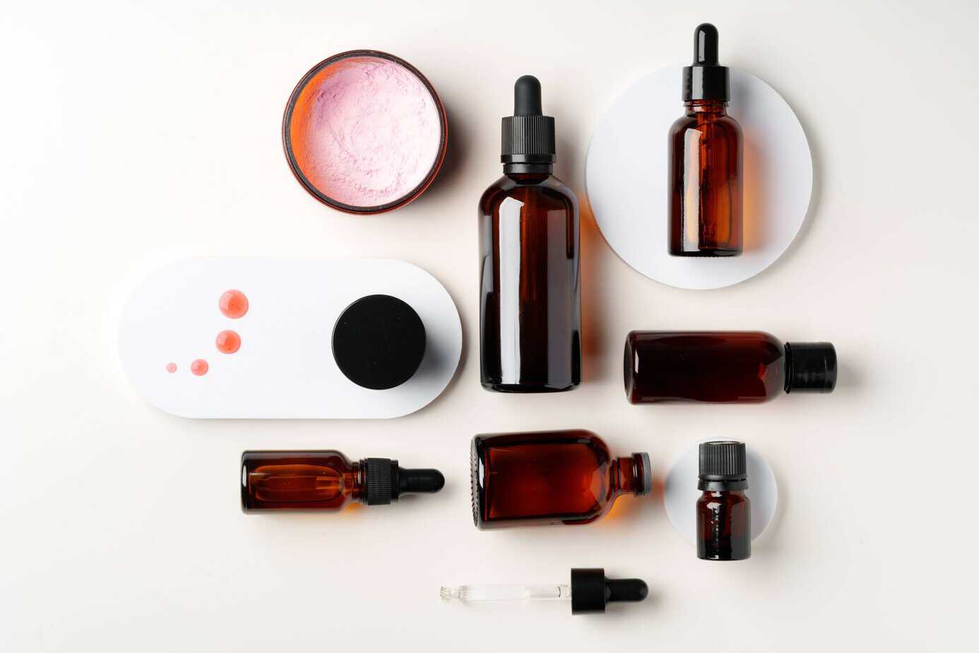 Finished organic skincare and haircare products — serum bottles and cosmetic jars